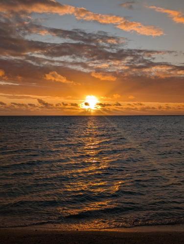 Wolmar Apartment | Beachfront 4-Bedroom Villa with Rooftop Sunset Terrace