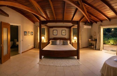 Cap Malheureux Apartment | Cinnamon Room Four-Poster Bed, Freestanding Bath, Walk-In Shower & Infinity Pool