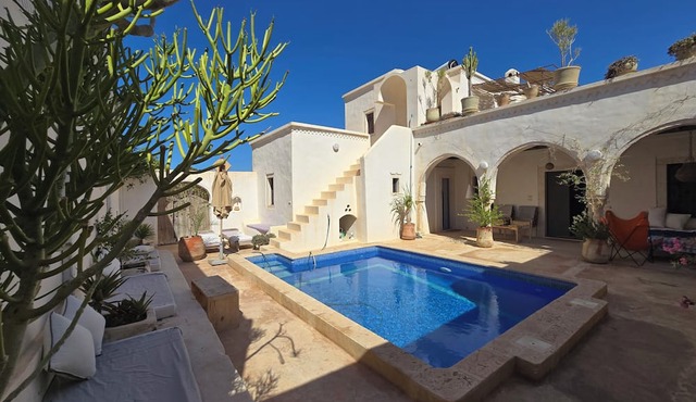 Dar Daoud, a traditional Djerban houch with a pool in the heart of the Djerbahood neighborhood.